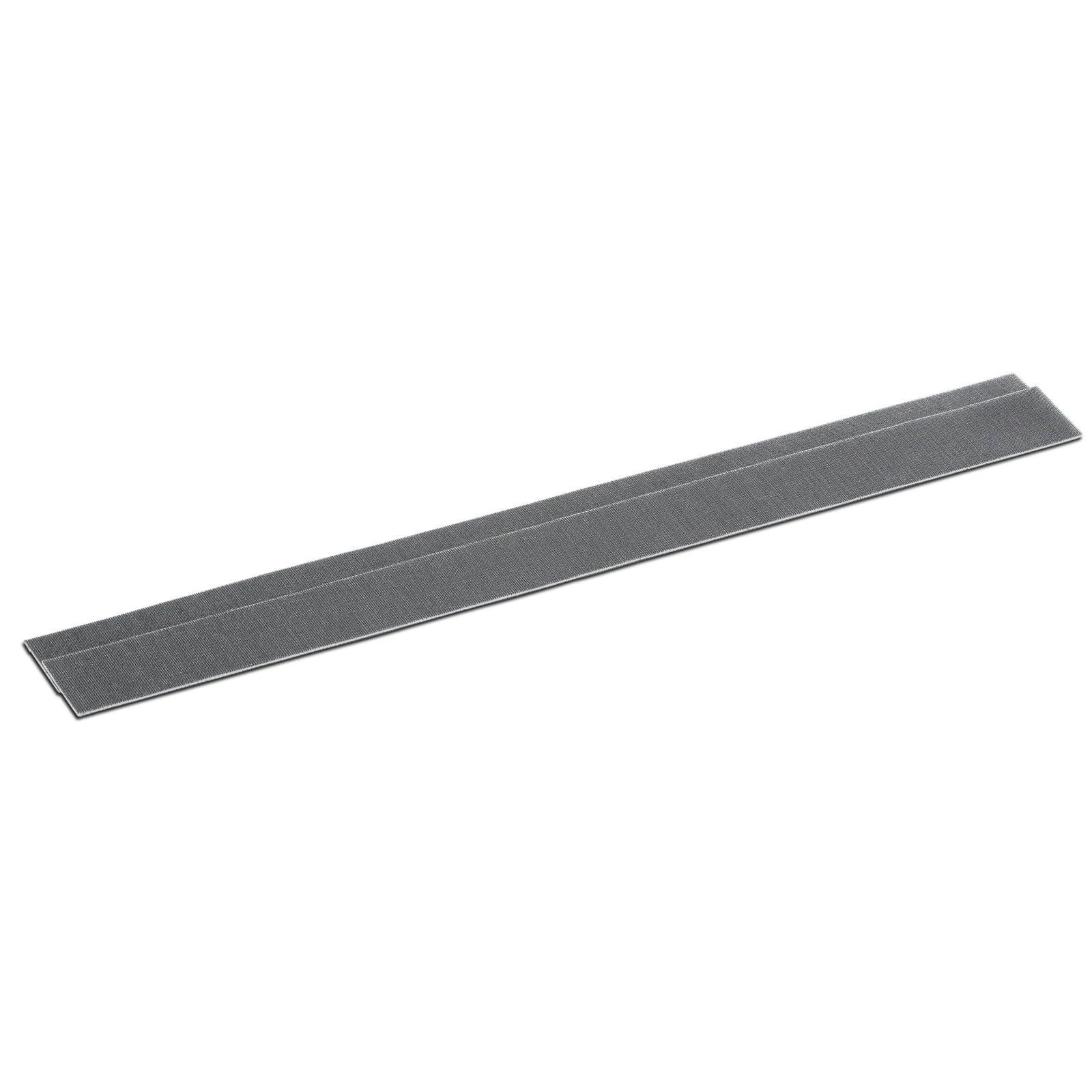 Graues Klettband, länglich und flach, auf weißem Hintergrund.