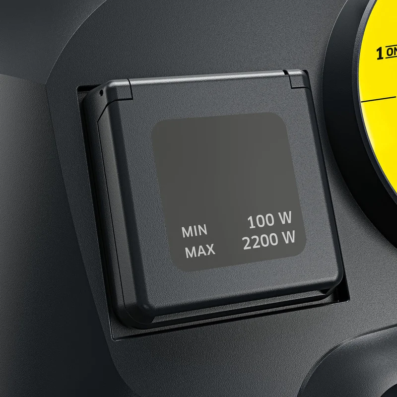 Nahaufnahme eines schwarzen Schalters mit Leistungseinstellungen von 100 W bis 2200 W auf einem Gerät.