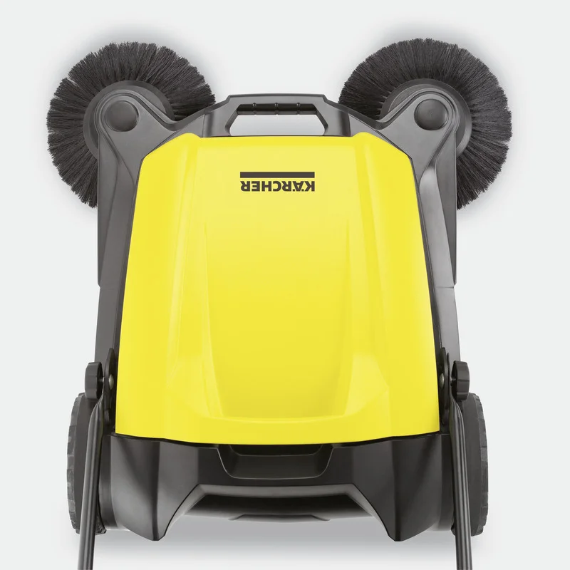 Gelber Kärcher Kehrmaschine mit zwei schwarzen Bürsten, Ansicht von oben.