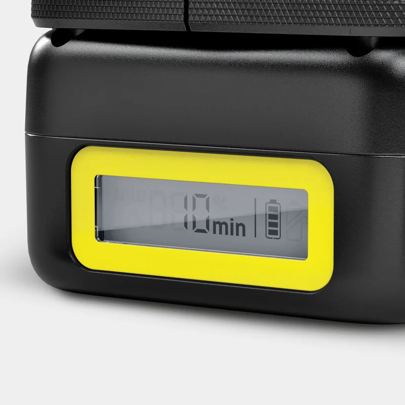 Nahaufnahme eines schwarzen Geräts mit gelbem Rahmen und Display, das "10 min" und ein Batterie-Symbol zeigt.